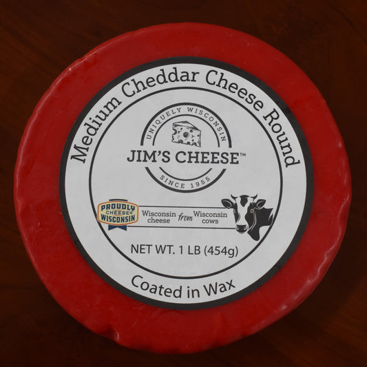 Jim's cheese medium cheddar cheese round wax coated